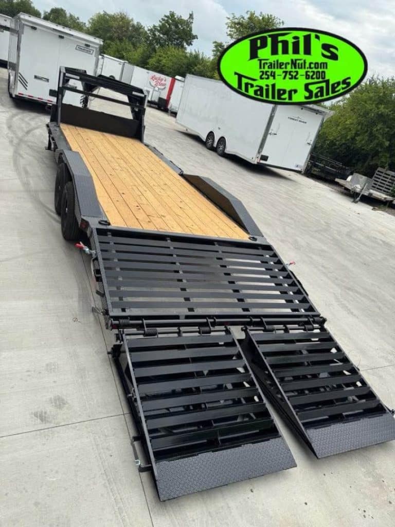 2026 Iron Bull 102 X 24 Gooseneck Equipment Trailer in black, rear view with wooden ramp down.