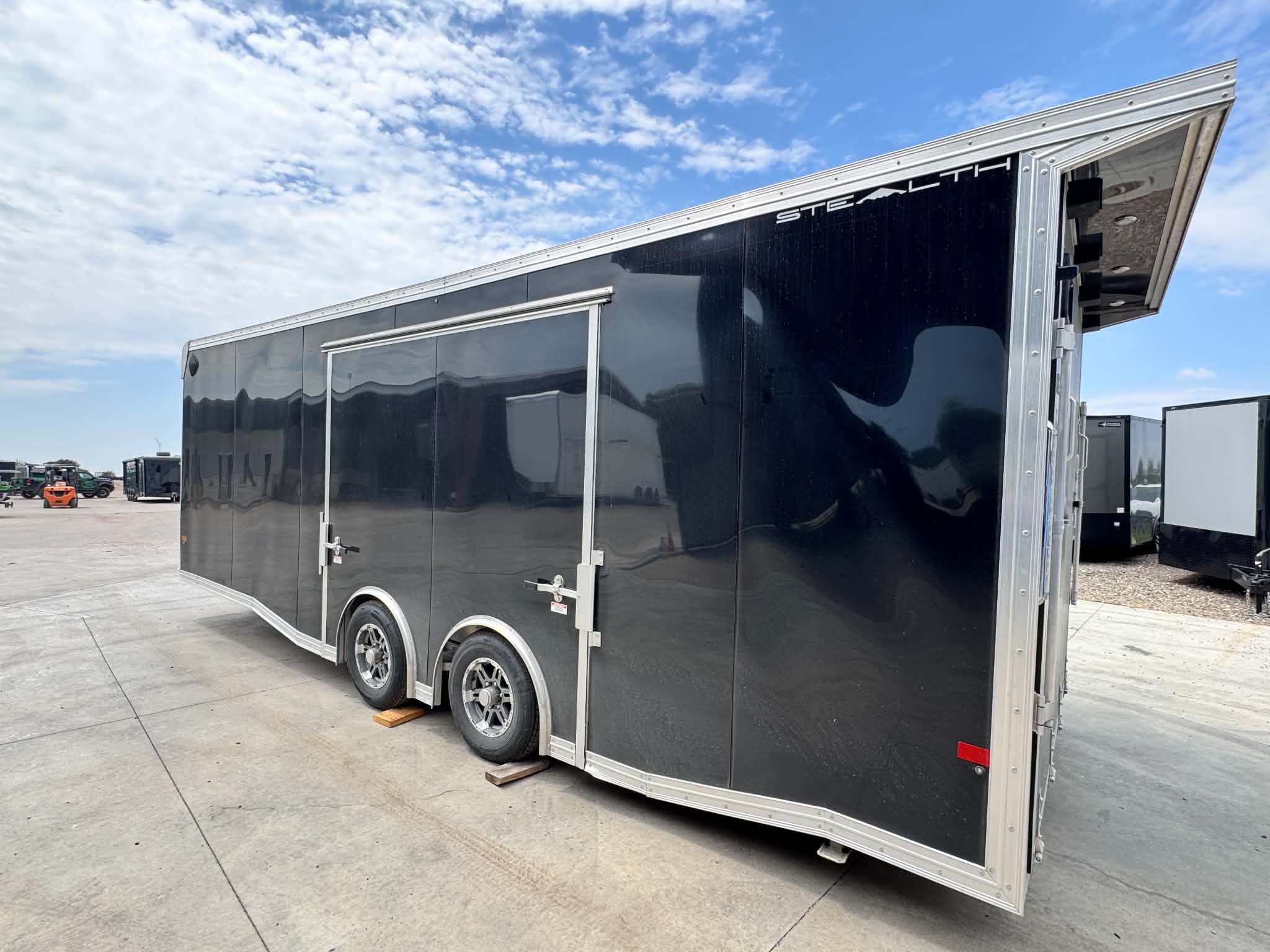 2024 USED STEALTH TRAILER 8.5X24 ALL ALUMINUM ENCLOSED CAR HAULER WITH FULL ESCAPE DOOR Used & Closeout Models, Car / Race Trailers